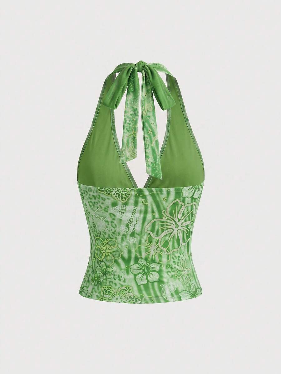 Women's pink tropical hibiscus print halter top featuring contrast lace trim and a slim fit silhouette.