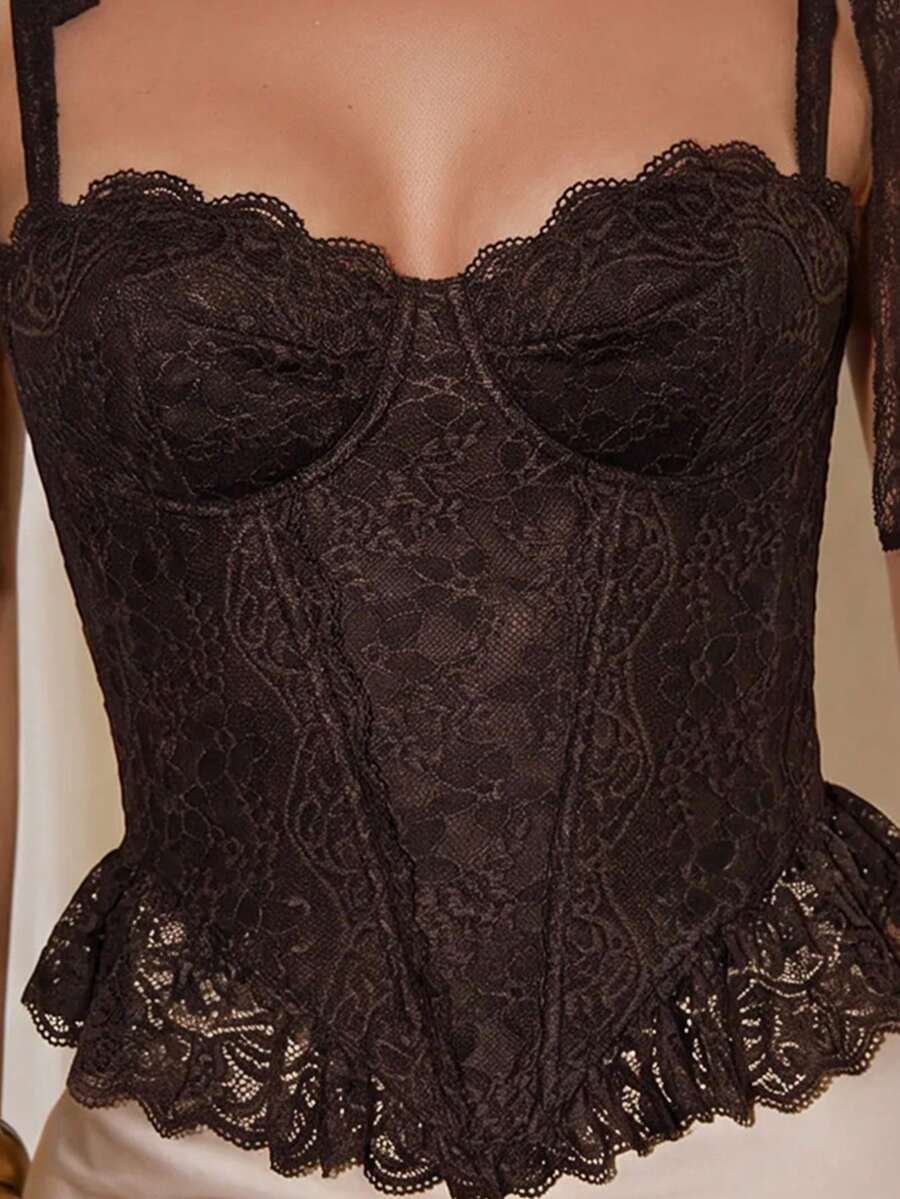 Women's lace camisole top featuring a boned bodice, sweetheart neckline, wide straps, and an asymmetrical crop hem.