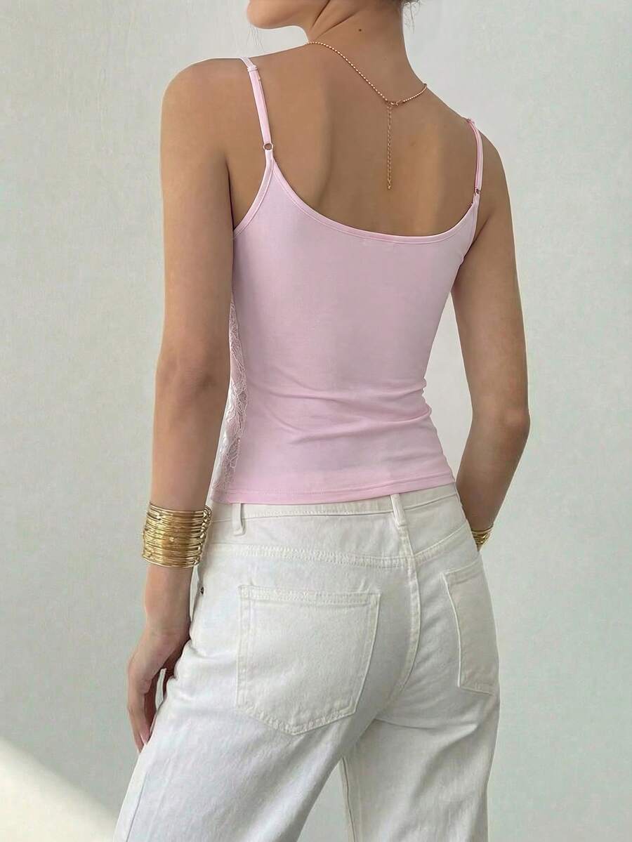 Women's sequin camisole top with spaghetti straps and a 3D rose embellishment