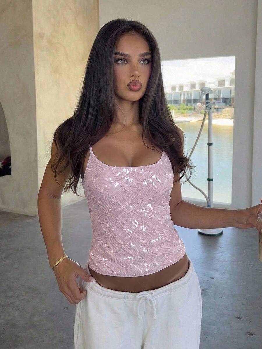 Women's sequin camisole top with spaghetti straps and a 3D rose embellishment