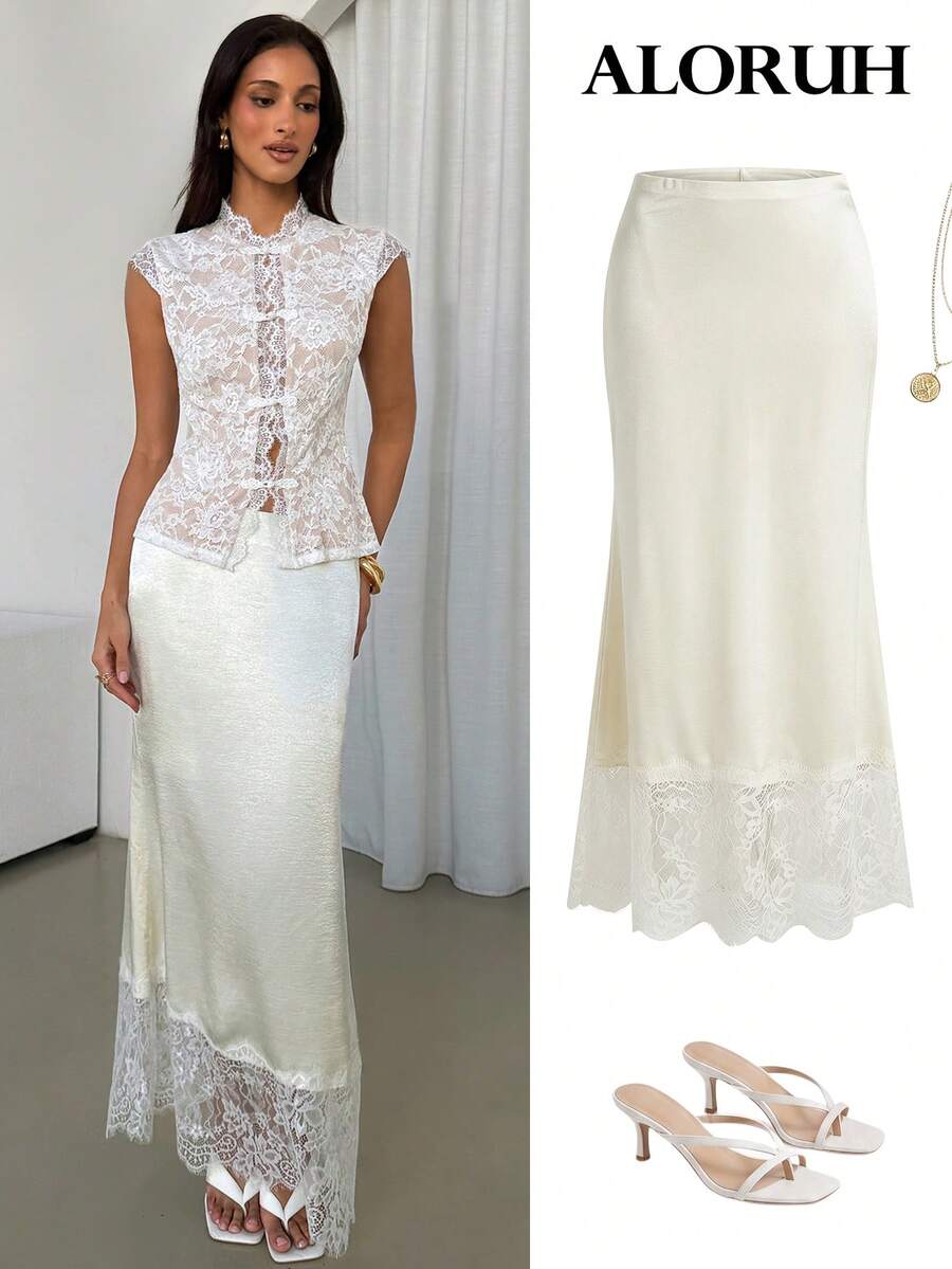 Woman wearing an elegant apricot satin maxi skirt featuring delicate contrast lace trim, a low waist design, and a flowing A-line silhouette.