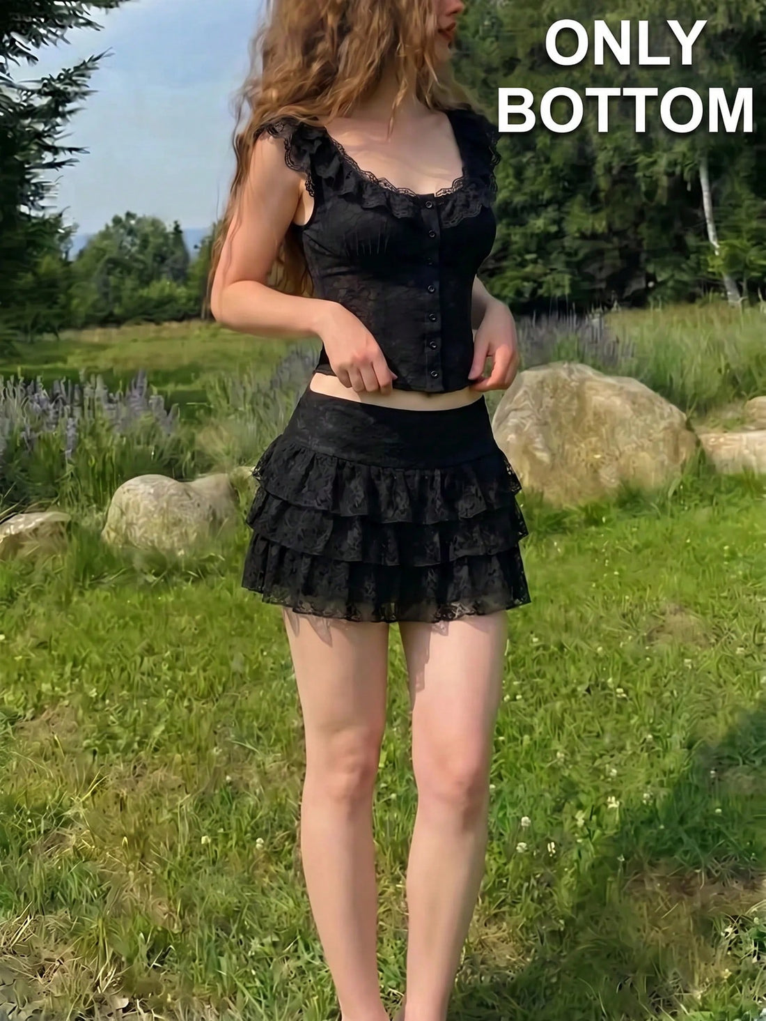 Women's black lace ruffle hem mini skirt with tiered layers and low waist line.