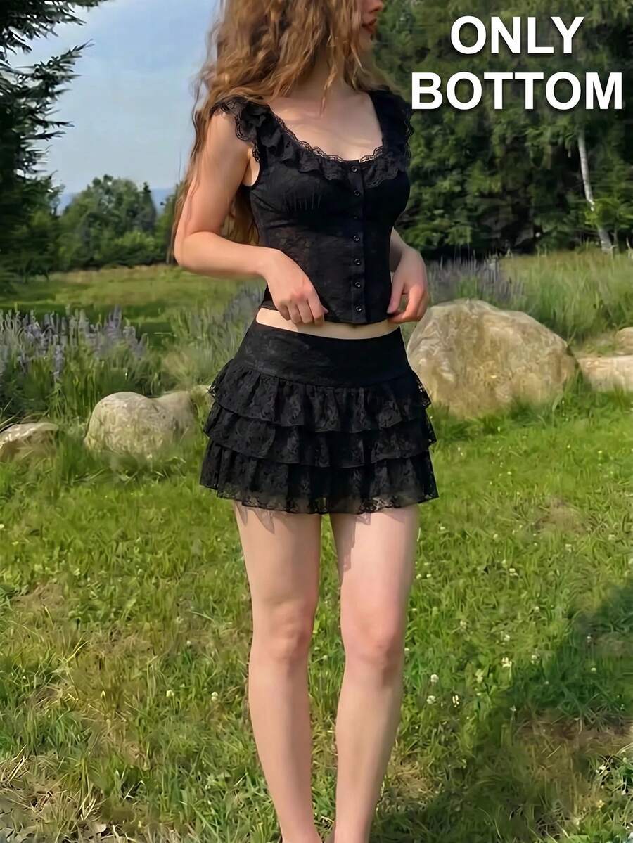 Women's black lace ruffle hem mini skirt with tiered layers and low waist line.