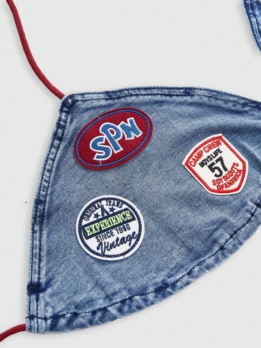 Blue denim sleeveless halter crop top for women featuring front knot tie detail and slim fit design.