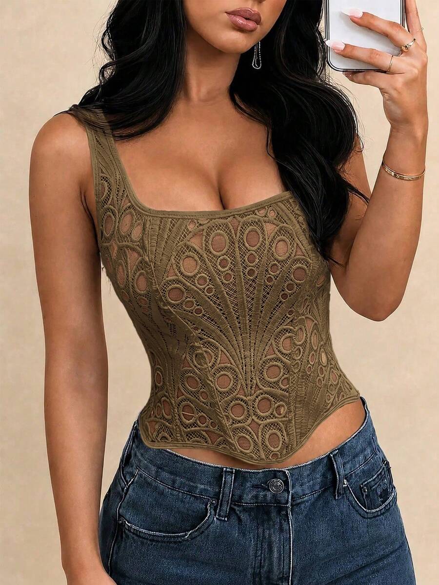 White slim fit boned corset top featuring a square neckline, wide straps, lace-up back, and asymmetrical hem.