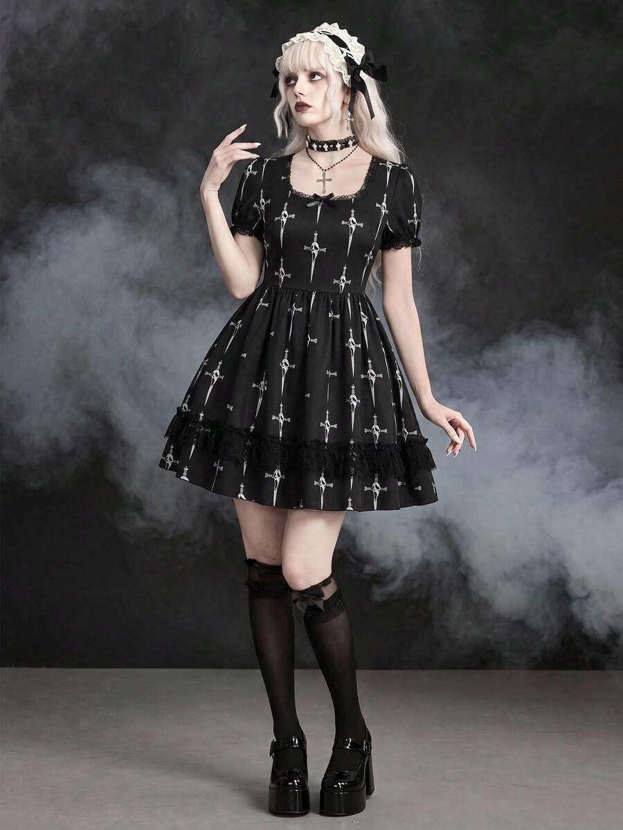 Black Gothic mini dress featuring cross skull print, square neckline with contrast lace trim, short puff sleeves, front drawstring detail, and high-waist flared A-line silhouette.