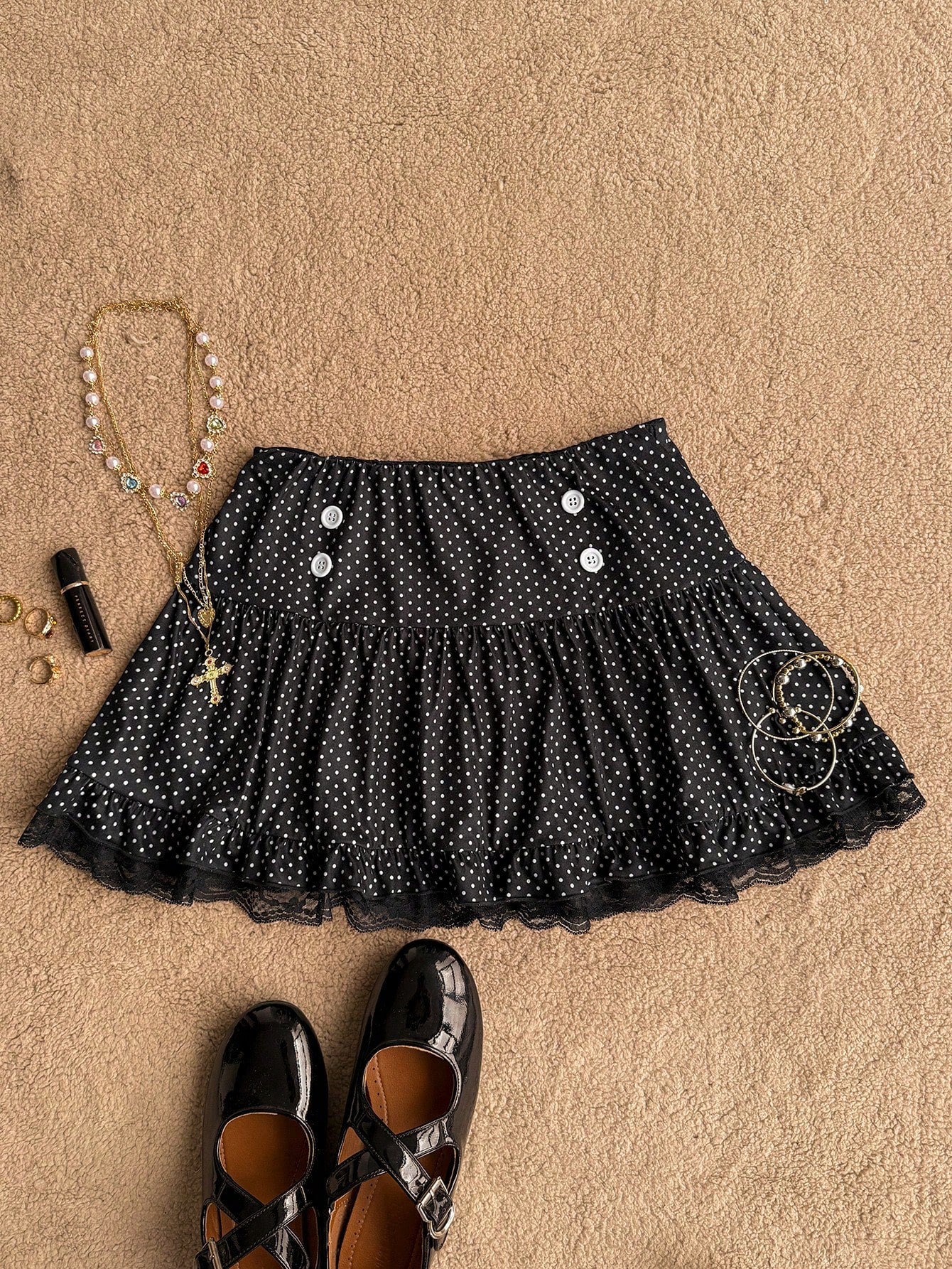 Women's plain black ultra low waist bodycon mini skirt with frill detailing in knitted stretch fabric.