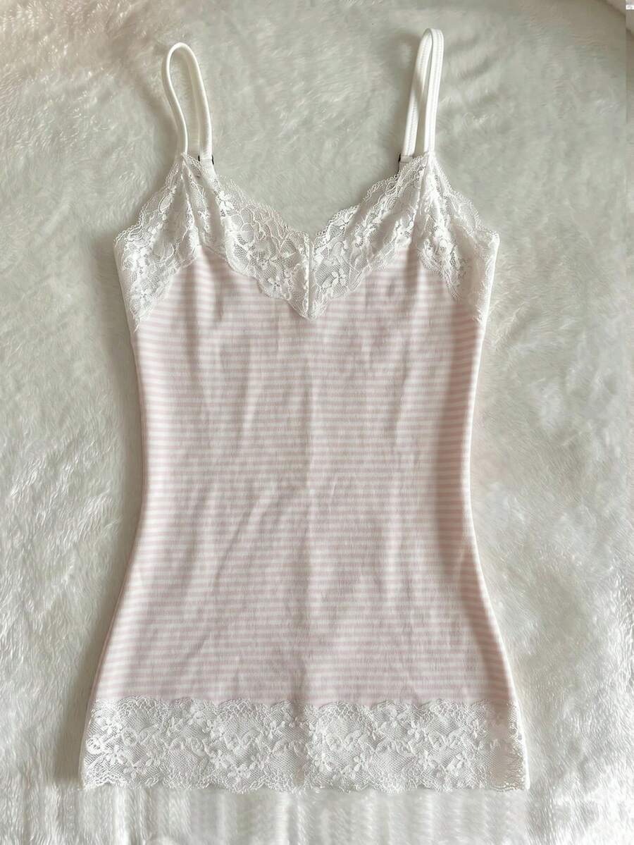 Women's solid color slim fit camisole top featuring delicate lace patchwork embroidery and tank straps.