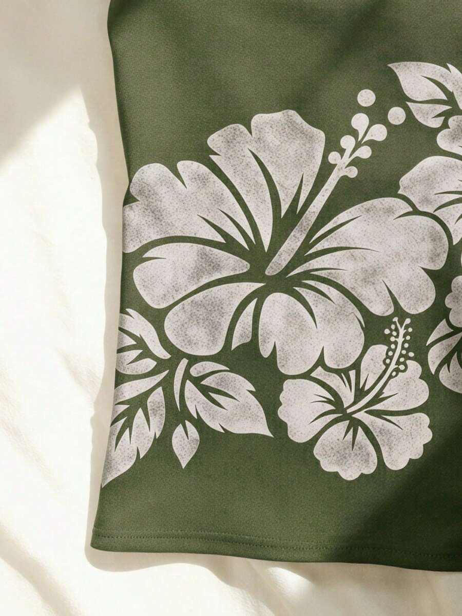 Women's blue floral print spaghetti strap camisole top in a slim fit short length design
