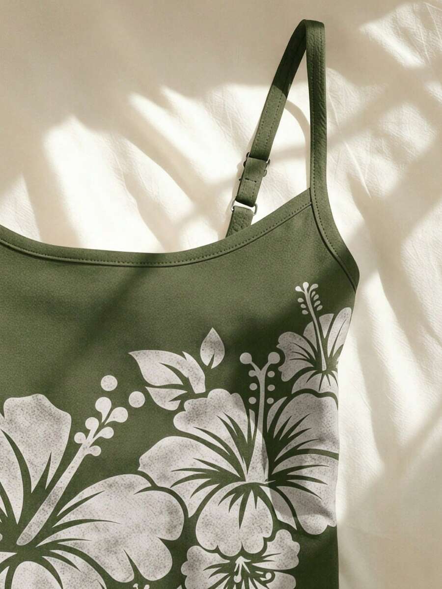 Women's blue floral print spaghetti strap camisole top in a slim fit short length design
