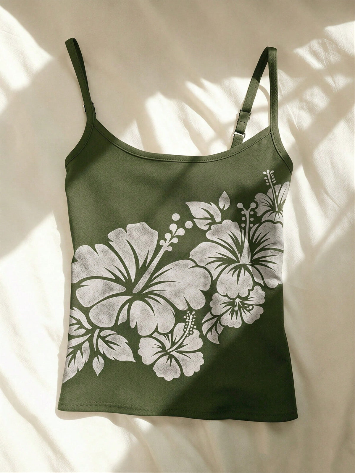 Women's blue floral print spaghetti strap camisole top in a slim fit short length design