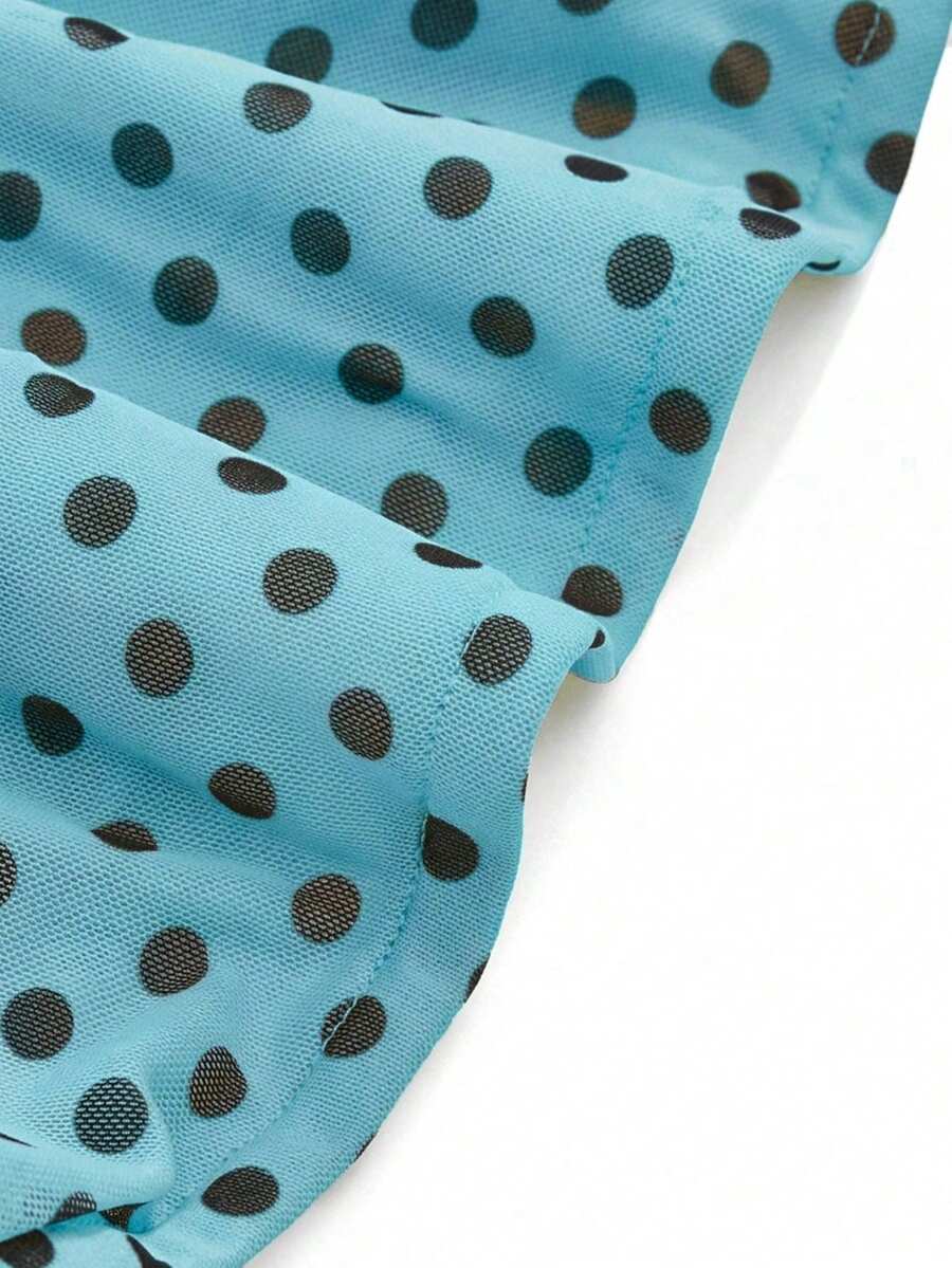 Women's black polka dot strapless tube top made of ruched mesh fabric featuring an asymmetrical hem and matching scarf.