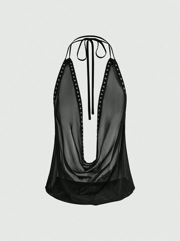 Women's black halter cowl backless crop top featuring asymmetrical draped hem and knot detail