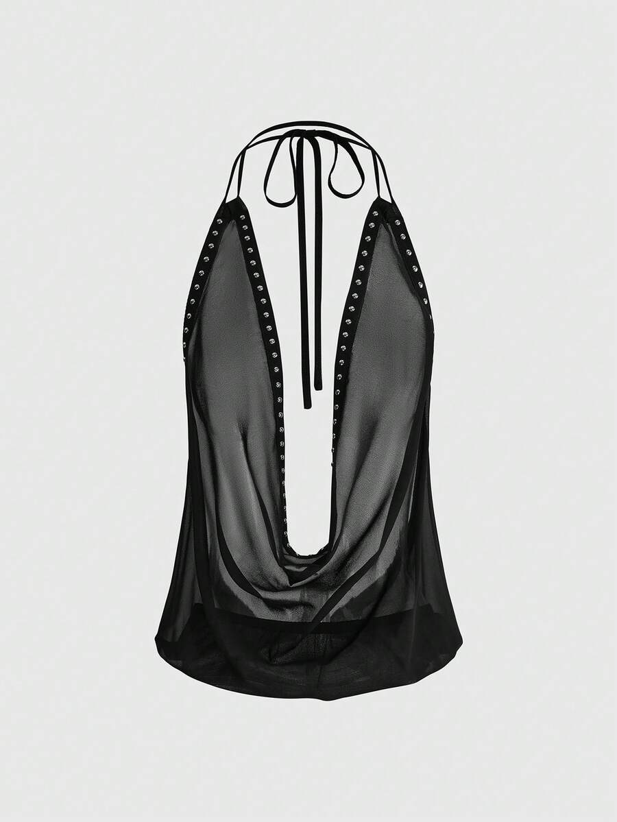 Women's black halter cowl backless crop top featuring asymmetrical draped hem and knot detail