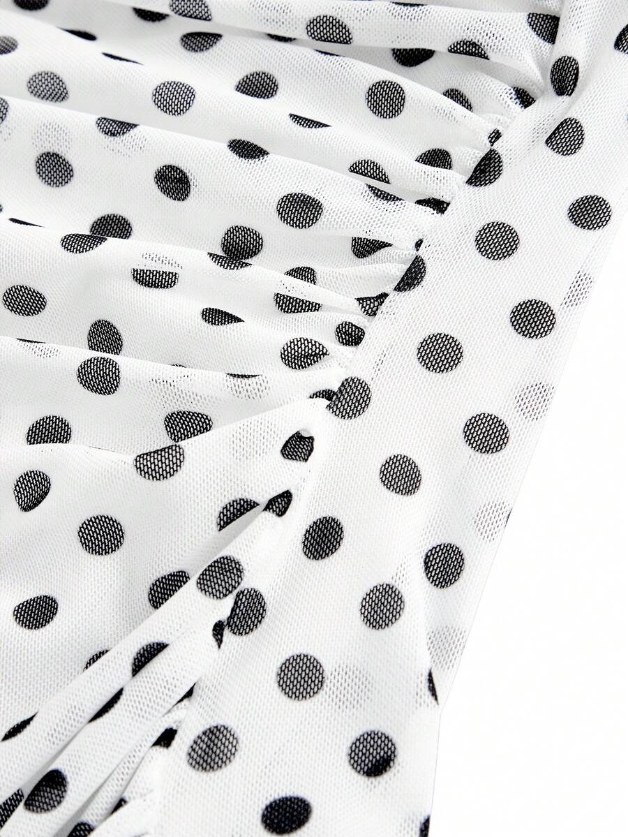 Women's black polka dot strapless tube top made of ruched mesh fabric featuring an asymmetrical hem and matching scarf.