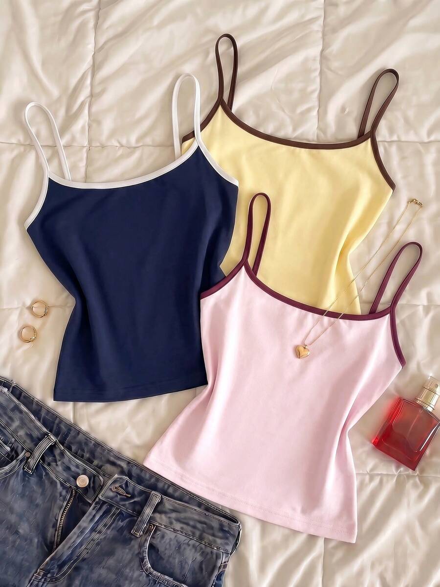 Navy blue women's geometric print spaghetti strap cami tank top with regular fit on plain background.