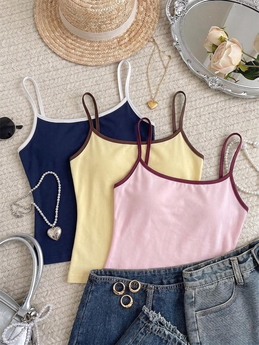 Navy blue women's geometric print spaghetti strap cami tank top with regular fit on plain background.