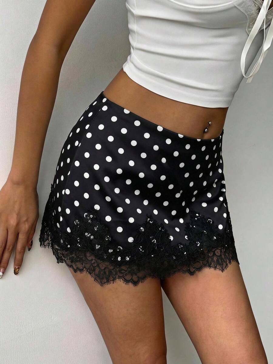 Women's black low waist bodycon short skirt with contrast lace hem detail, knot design, and back zipper closure.