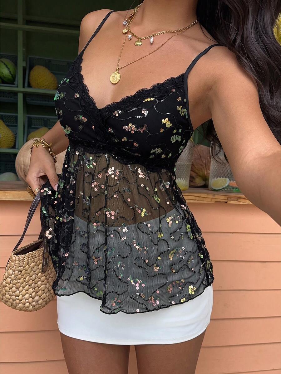 Women's black sequin lace patchwork camisole top featuring thin spaghetti straps, contrast lace trim, and an asymmetrical ruffle hem with knot details.