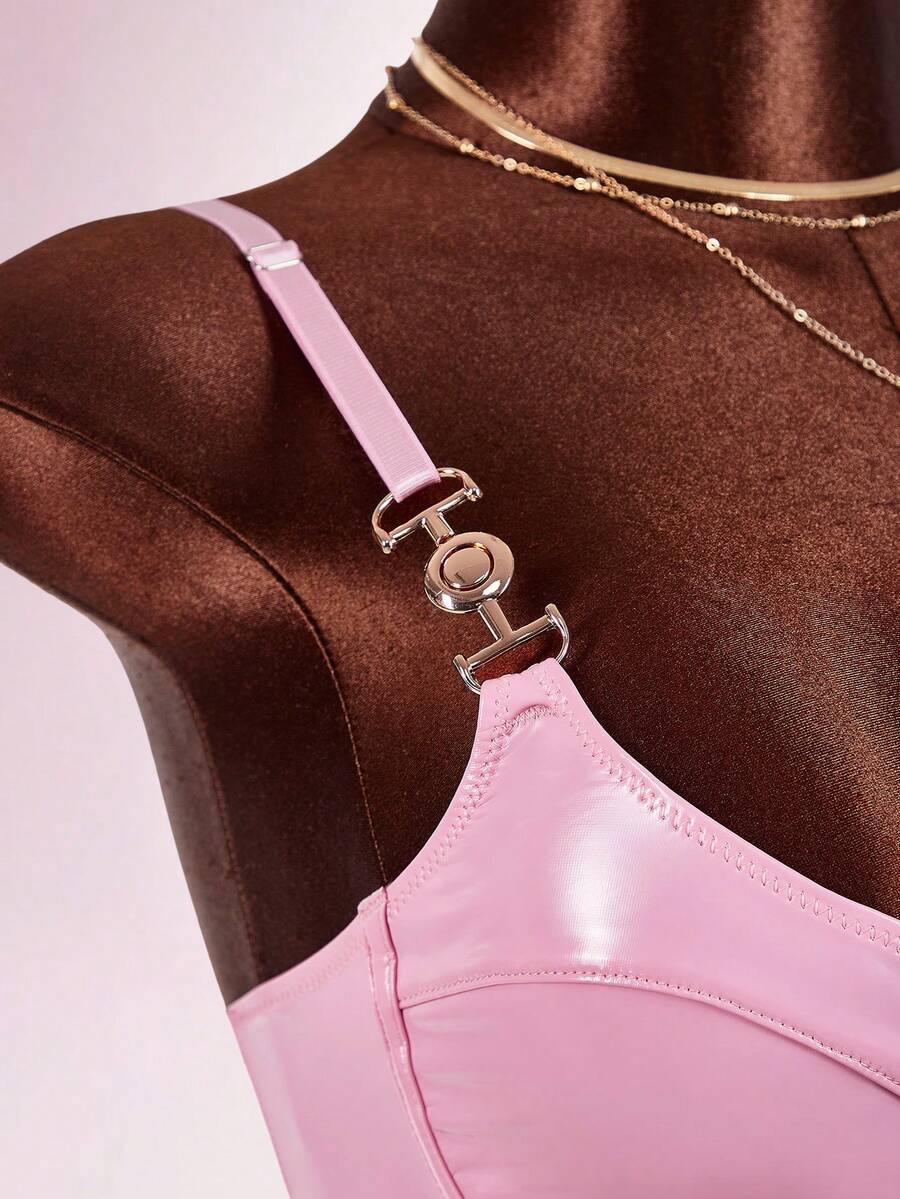 Women's sleeveless spaghetti strap mini bodycon dress featuring cup details, backless design, and zipper closure.