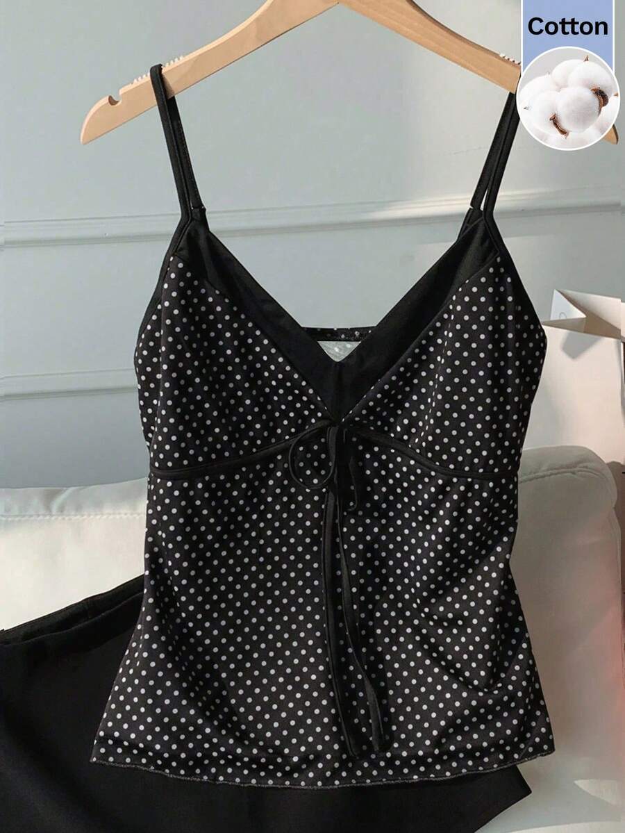 Black and white polka dot tie strap camisole top for women with thin spaghetti straps and slim fit.