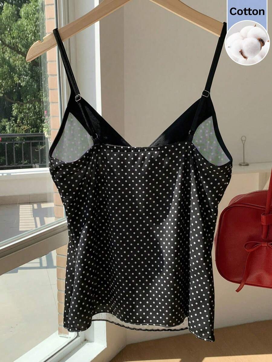Black and white polka dot tie strap camisole top for women with thin spaghetti straps and slim fit.