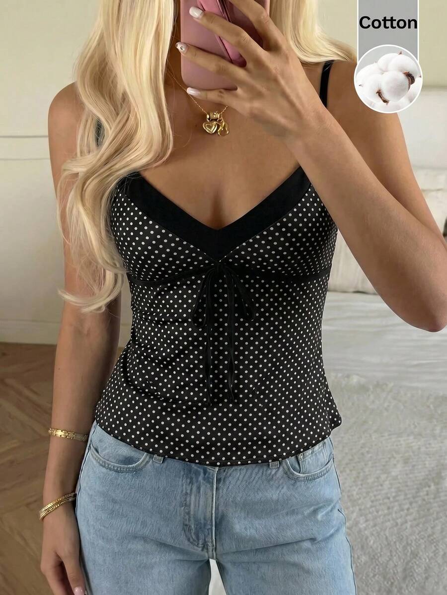 Black and white polka dot tie strap camisole top for women with thin spaghetti straps and slim fit.