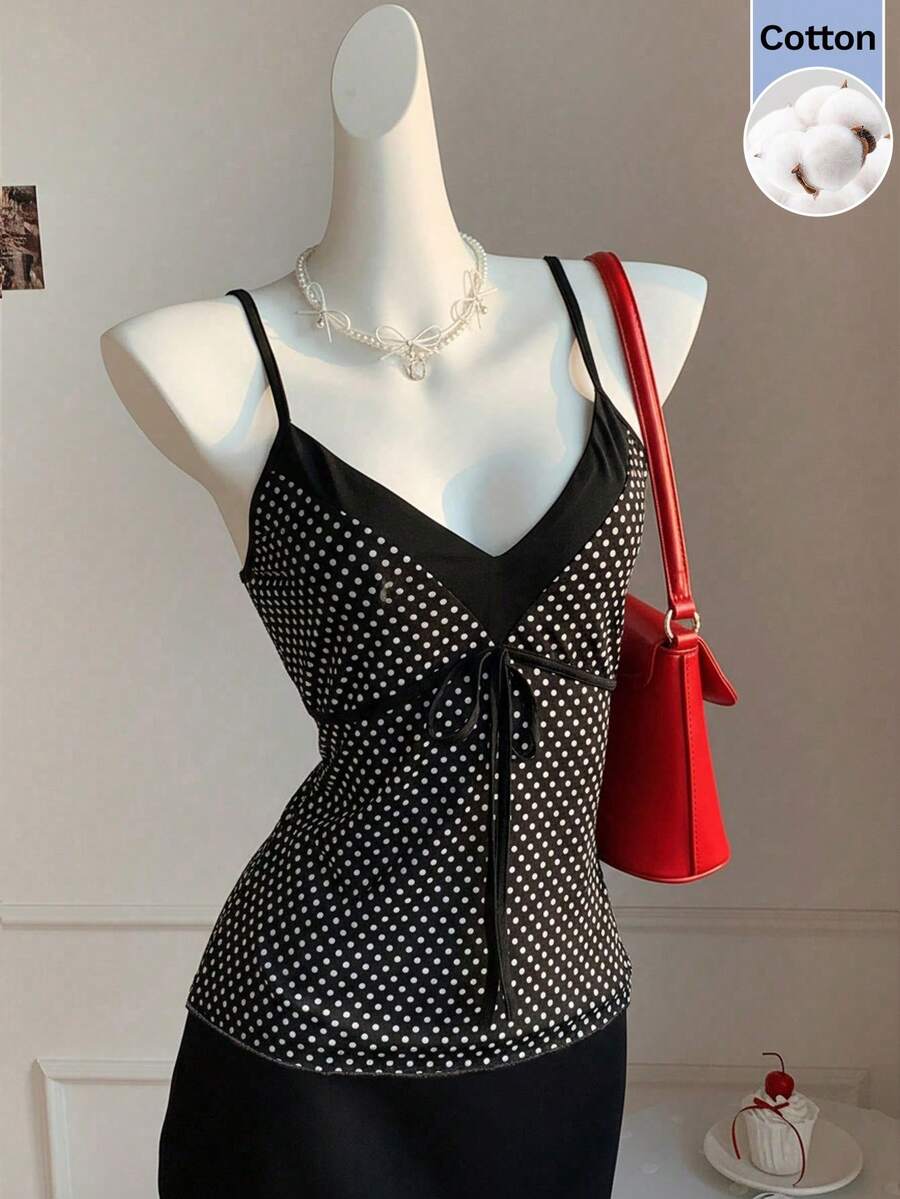Black and white polka dot tie strap camisole top for women with thin spaghetti straps and slim fit.