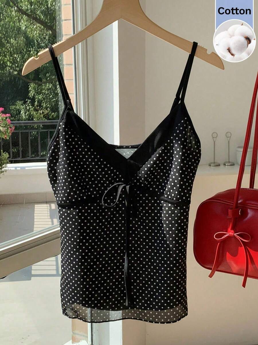 Black and white polka dot tie strap camisole top for women with thin spaghetti straps and slim fit.