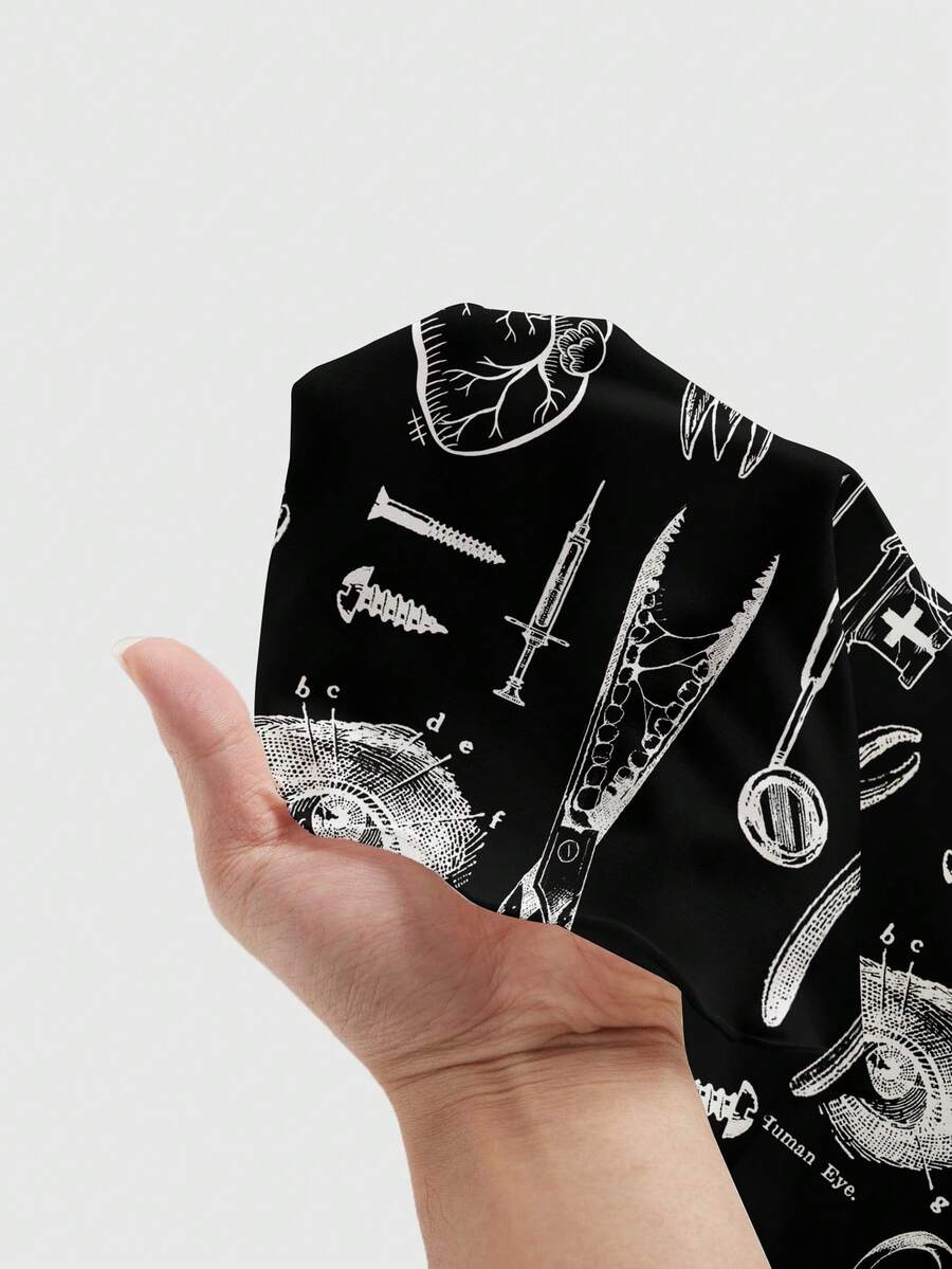 Black gothic print cami mini dress for women featuring spaghetti straps, backless high waist, flared lettuce trim hem, and matching arm sleeves.