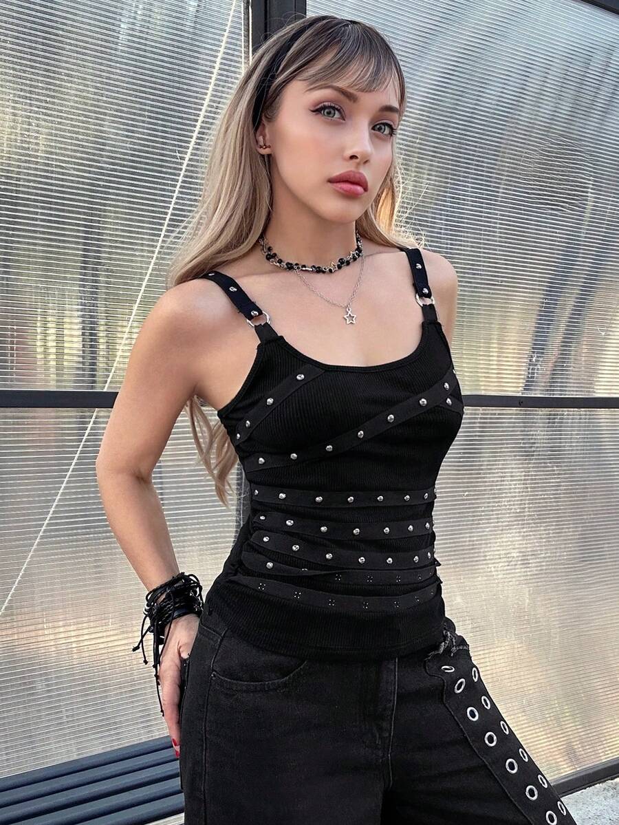 Women's black wide-strap cami top featuring rhinestone embellishments, cut-out accents, and grommet eyelets.
