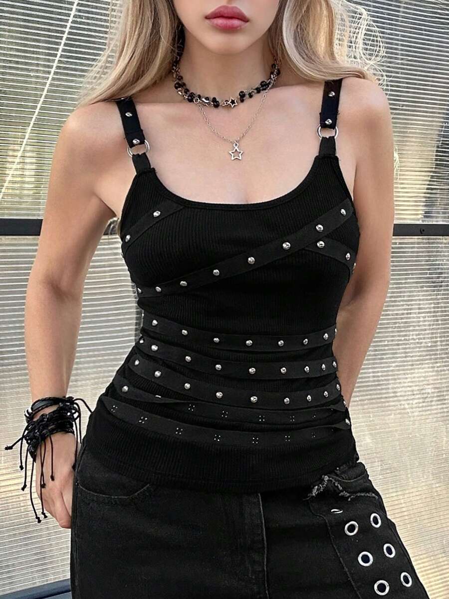 Women's black wide-strap cami top featuring rhinestone embellishments, cut-out accents, and grommet eyelets.