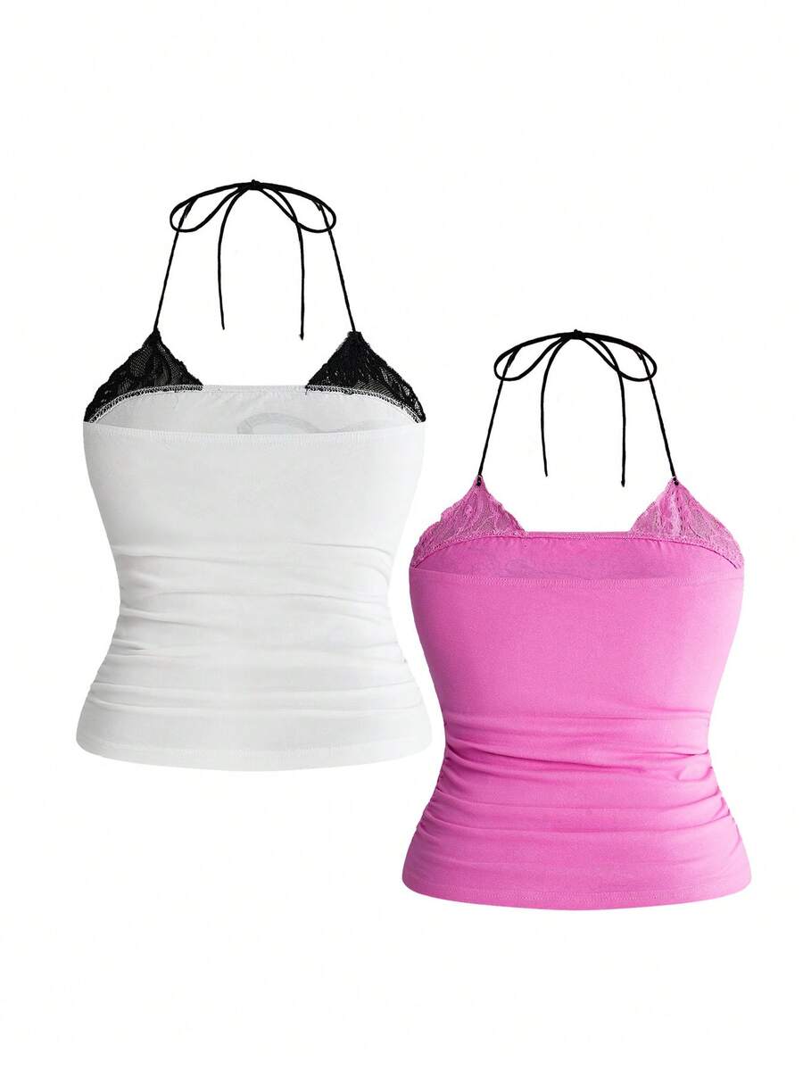 Multicolor graphic crop halter top with contrast lace trim and knot detail in a slim fit stretch knit fabric.