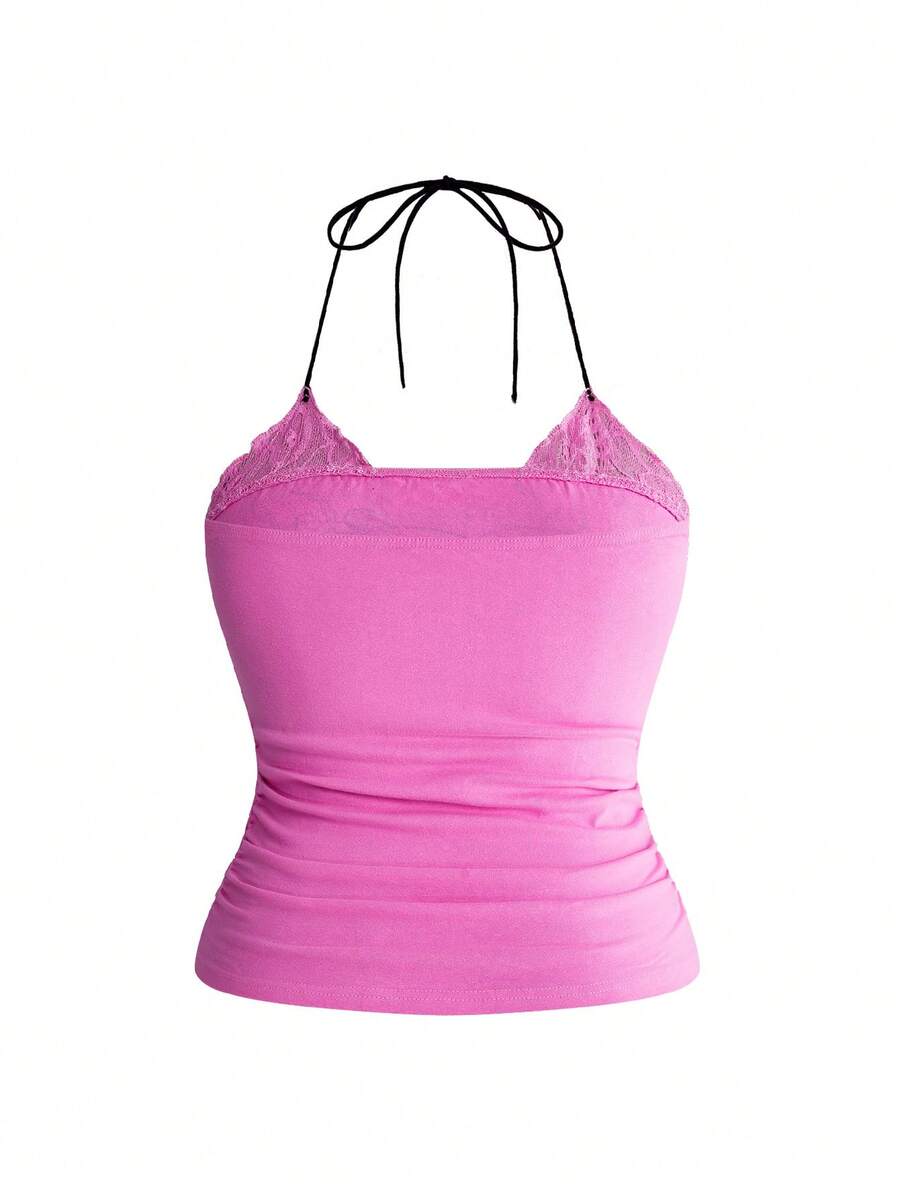 Multicolor graphic crop halter top with contrast lace trim and knot detail in a slim fit stretch knit fabric.