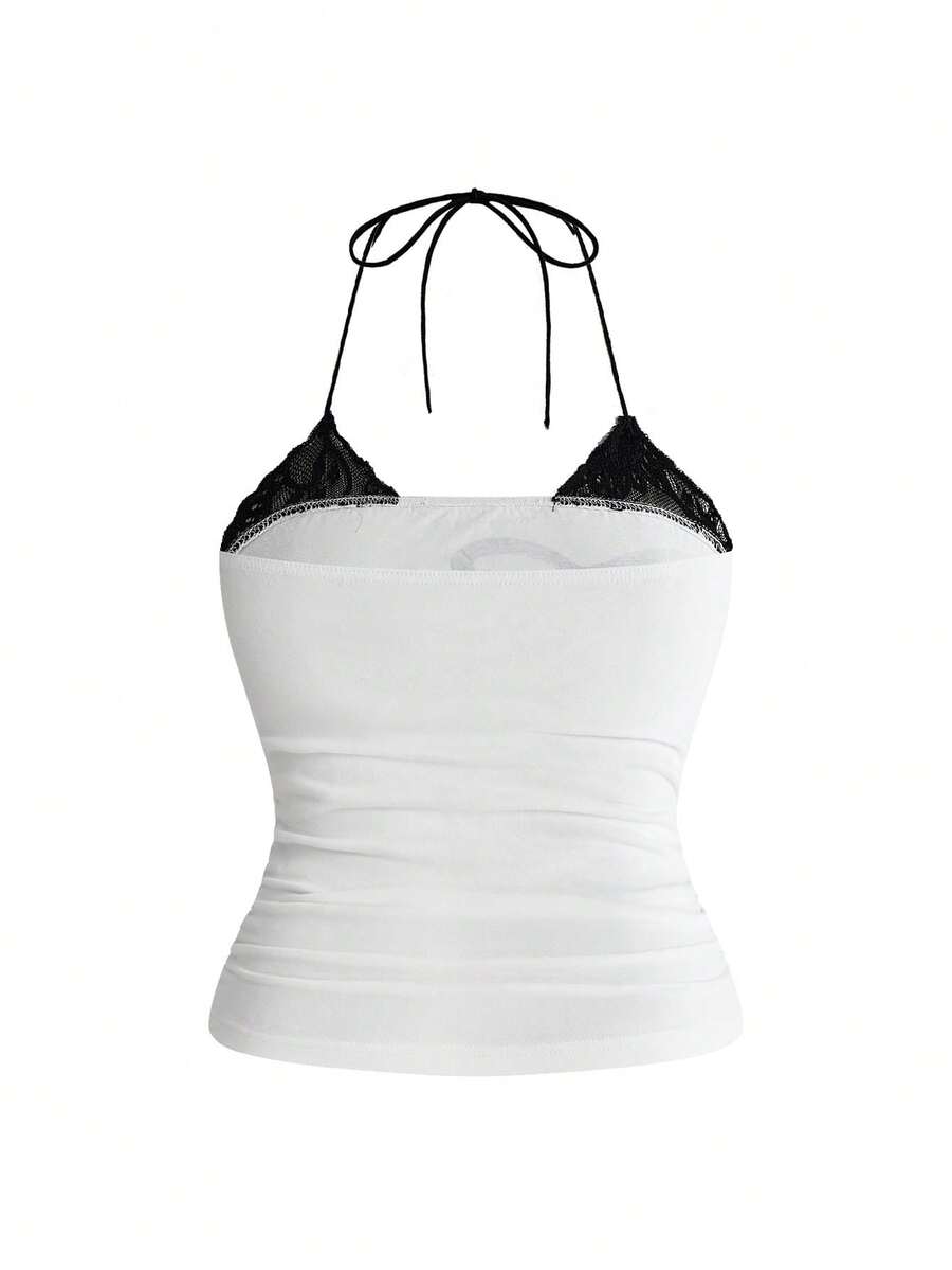 Multicolor graphic crop halter top with contrast lace trim and knot detail in a slim fit stretch knit fabric.