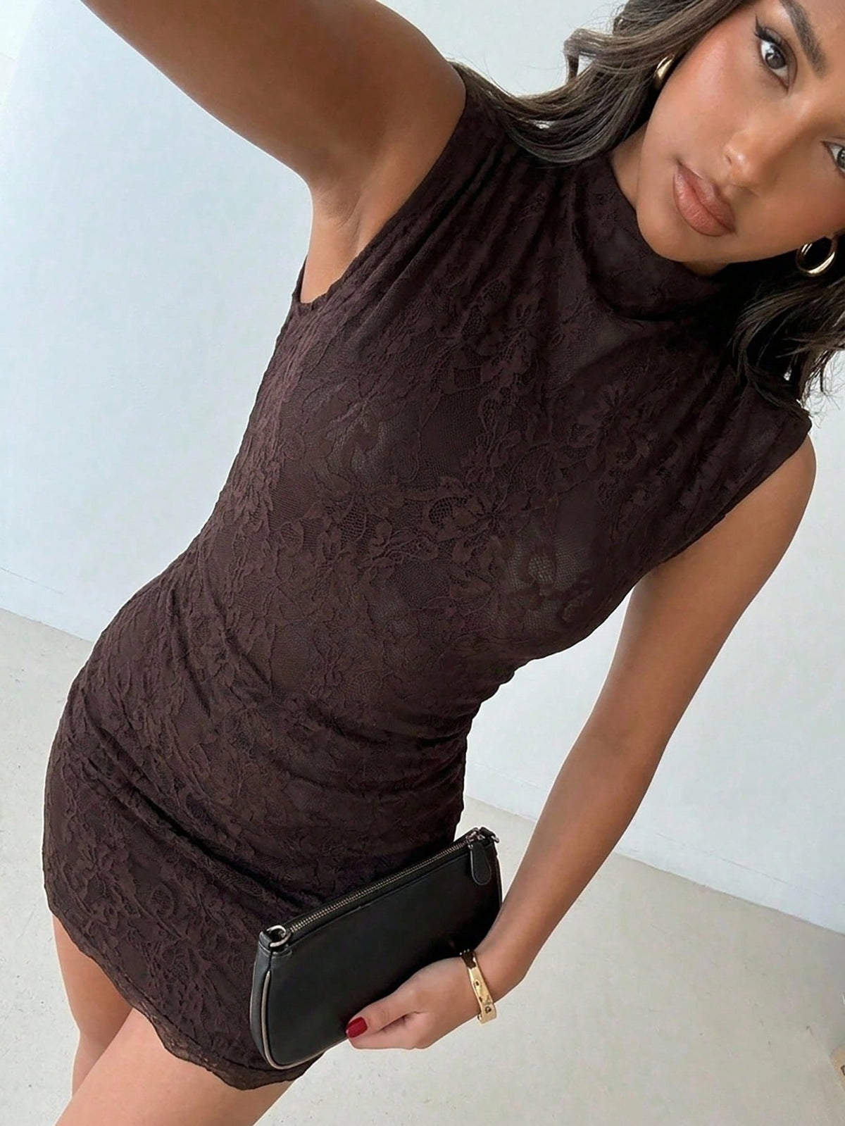Army green sleeveless bodycon mini dress with a stand collar, ruched details, and zipper back.
