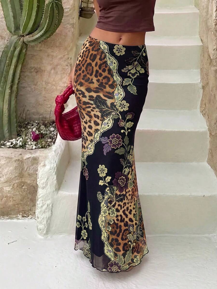Black women's vintage floral print mermaid maxi skirt featuring ruched detail and low waist styling for a night out.
