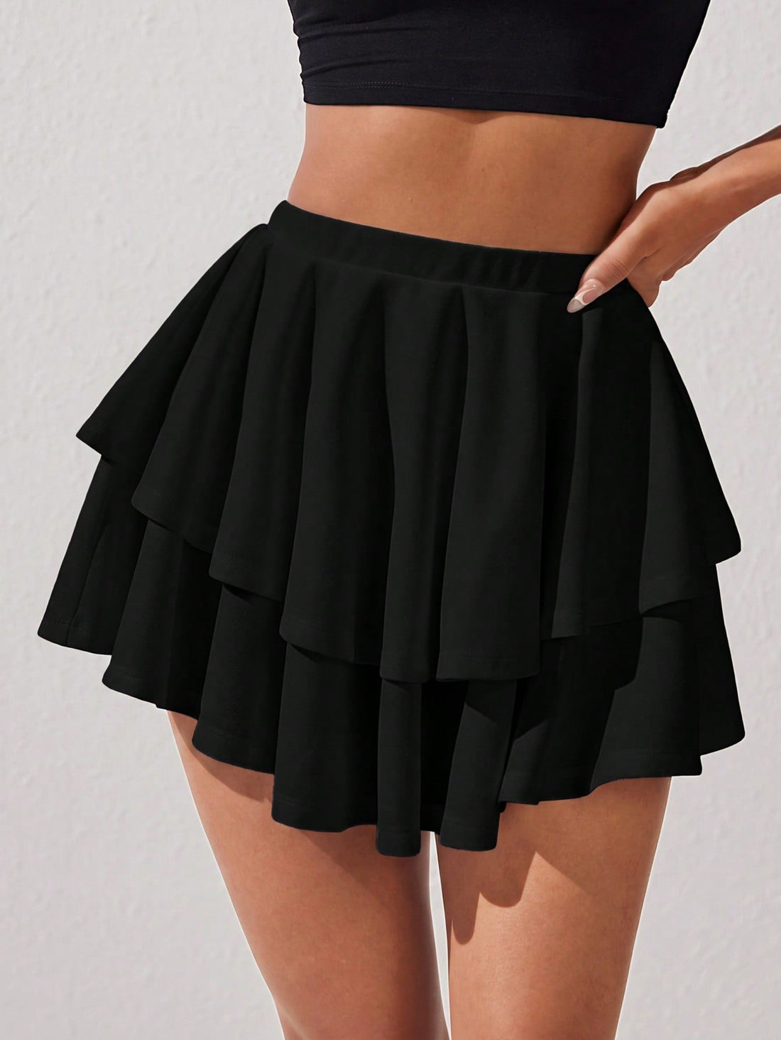 Women's high waist layered ruffle mini skirt skort with a tiered hem design in a casual loose fit.