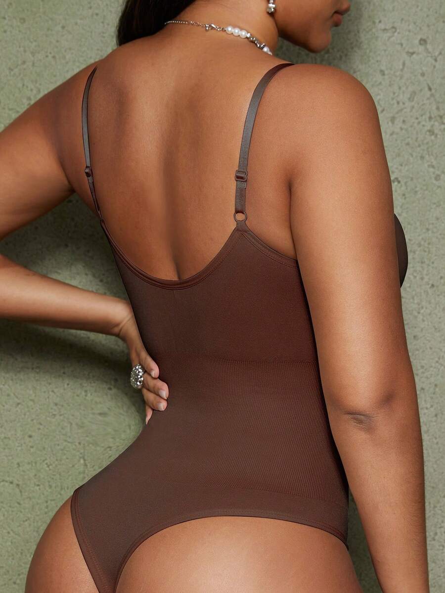 Brown seamless shapewear bodysuit featuring backless design, thong bottom, non-removable padding, and high-stretch fabric for tummy and waist control.
