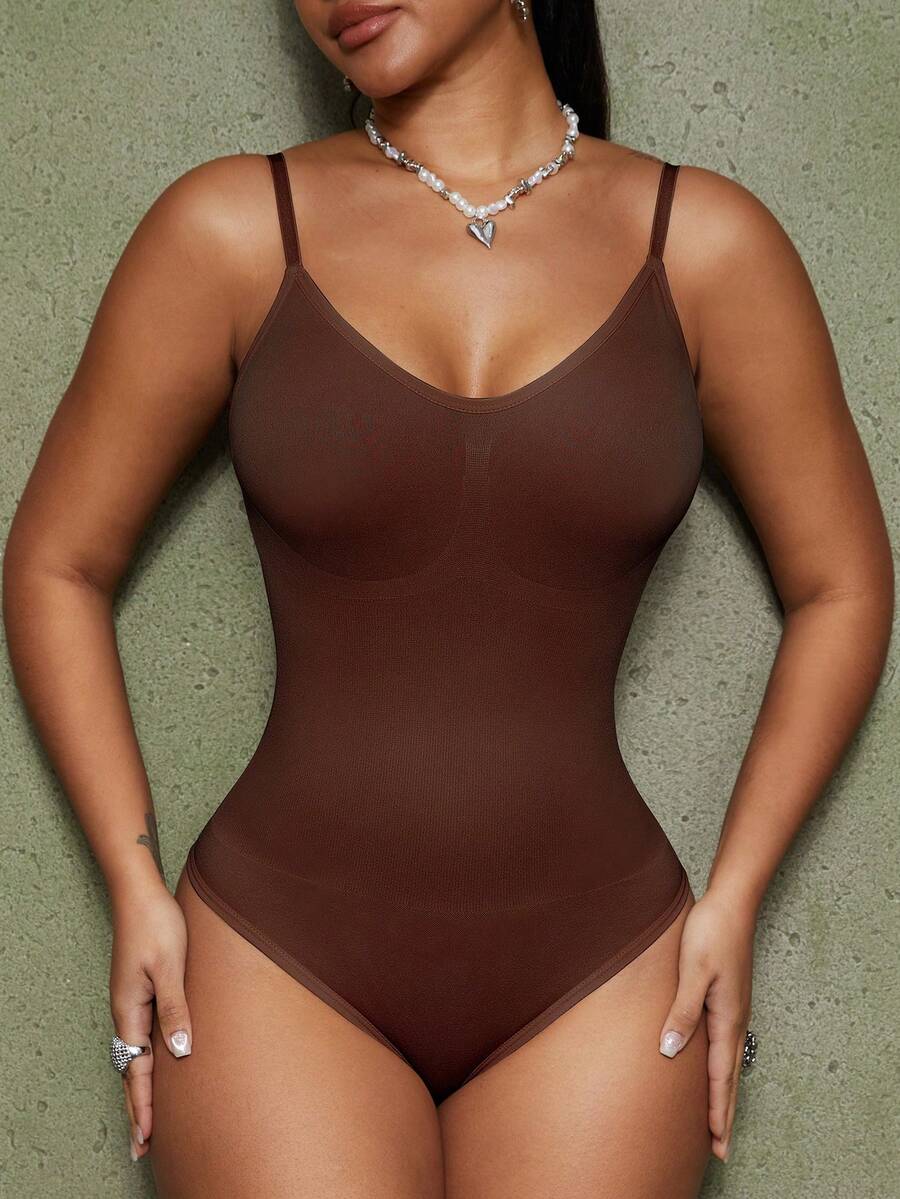 Brown seamless shapewear bodysuit featuring backless design, thong bottom, non-removable padding, and high-stretch fabric for tummy and waist control.