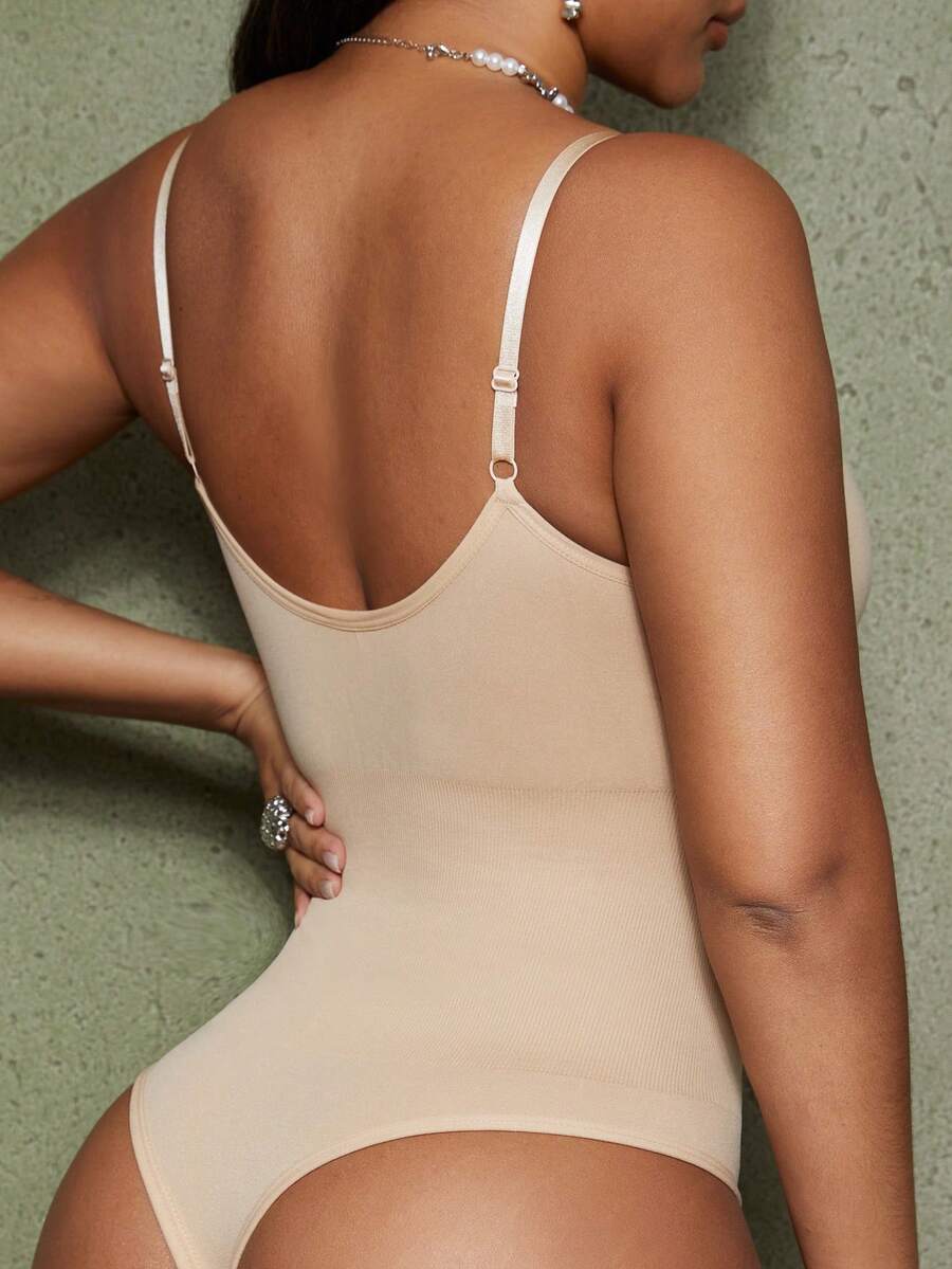 Brown seamless shapewear bodysuit featuring backless design, thong bottom, non-removable padding, and high-stretch fabric for tummy and waist control.
