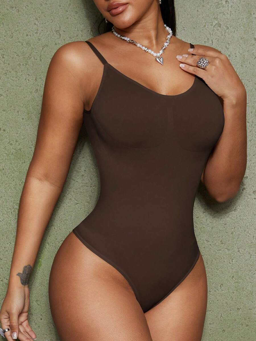 Brown seamless backless shaping bodysuit for women featuring a thong bottom and non-removable padding.