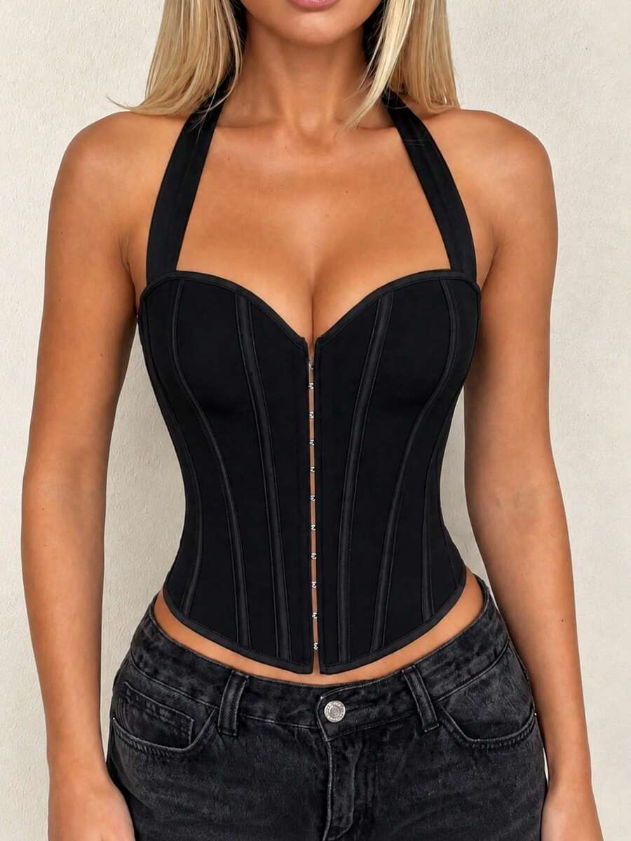 White Y2K halter backless corset top featuring lace-up back detail and metal grommet eyelets for women