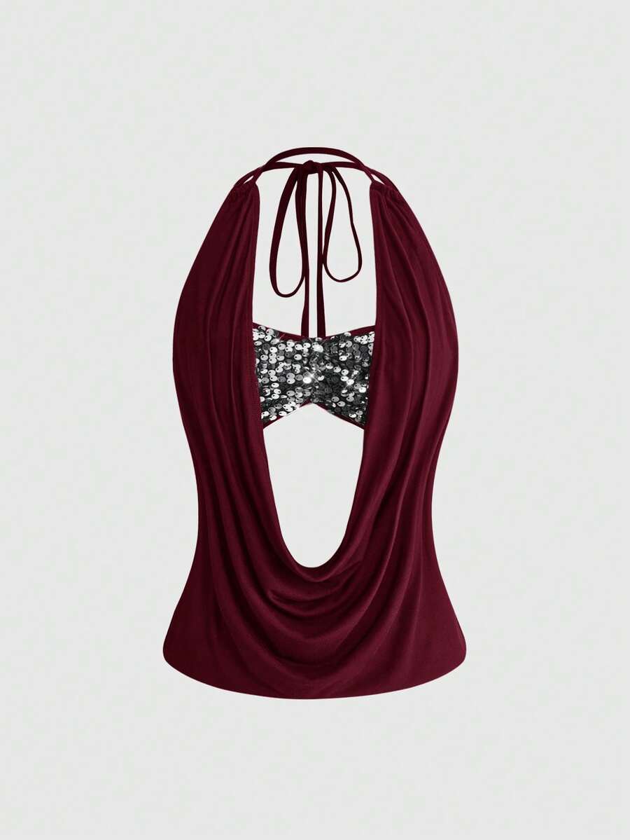 Women's black sequin halter tank top featuring a draped cowl neck and backless design