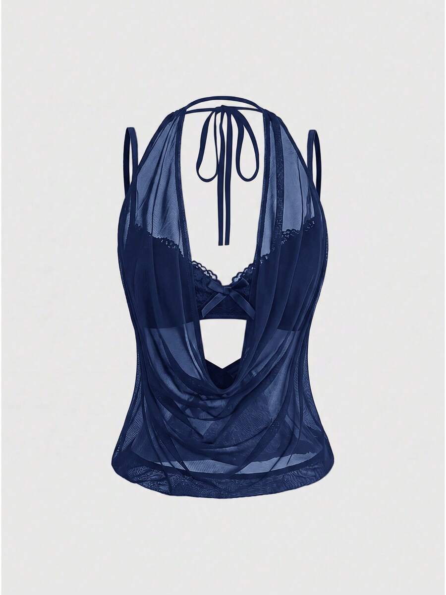 Women wearing a black draped backless halter crop top layered over a boned lace camisole.