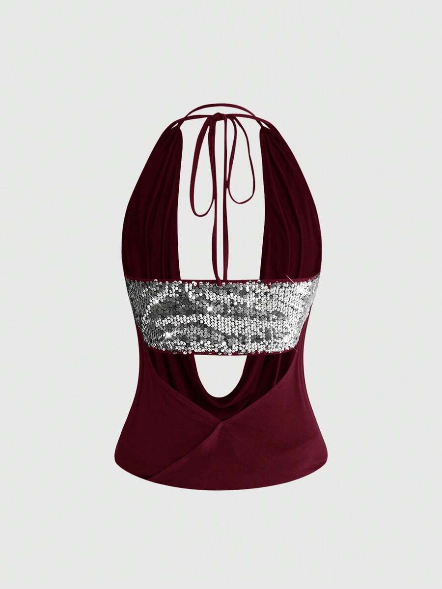 Women's black sequin halter tank top featuring a draped cowl neck and backless design