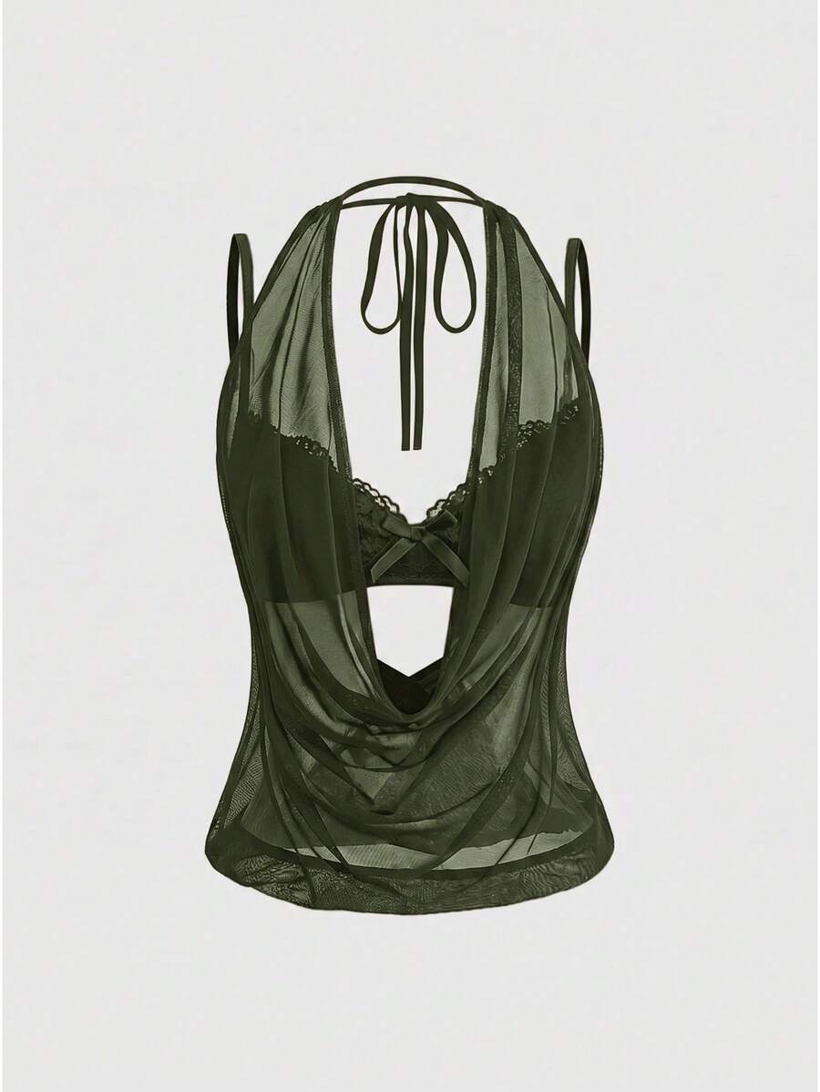 Women wearing a black draped backless halter crop top layered over a boned lace camisole.