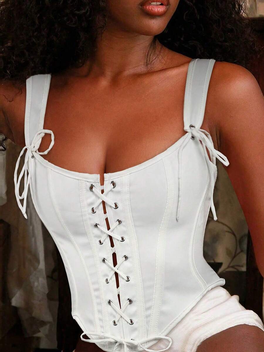 Apperloth women's red plaid corset top featuring a lace-up front with bow detail, shoulder straps, and a slim cropped fit.