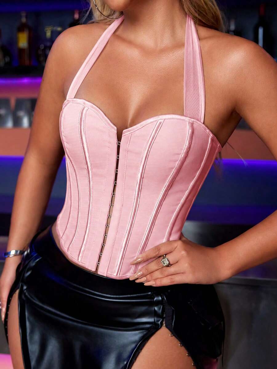 White Y2K halter backless corset top featuring lace-up back detail and metal grommet eyelets for women
