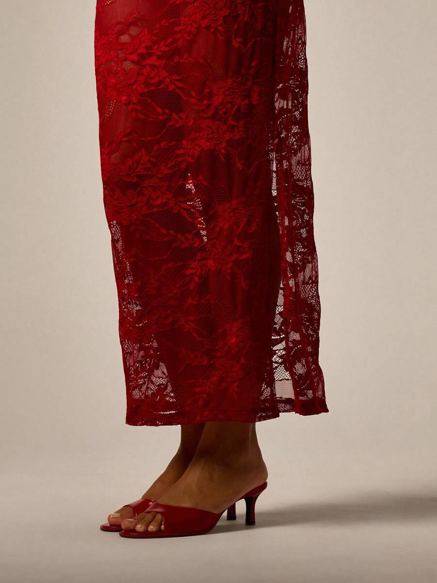 Red sheer floral lace pencil maxi skirt featuring a side split, mid waist fit, and high stretch unlined lace material for women.